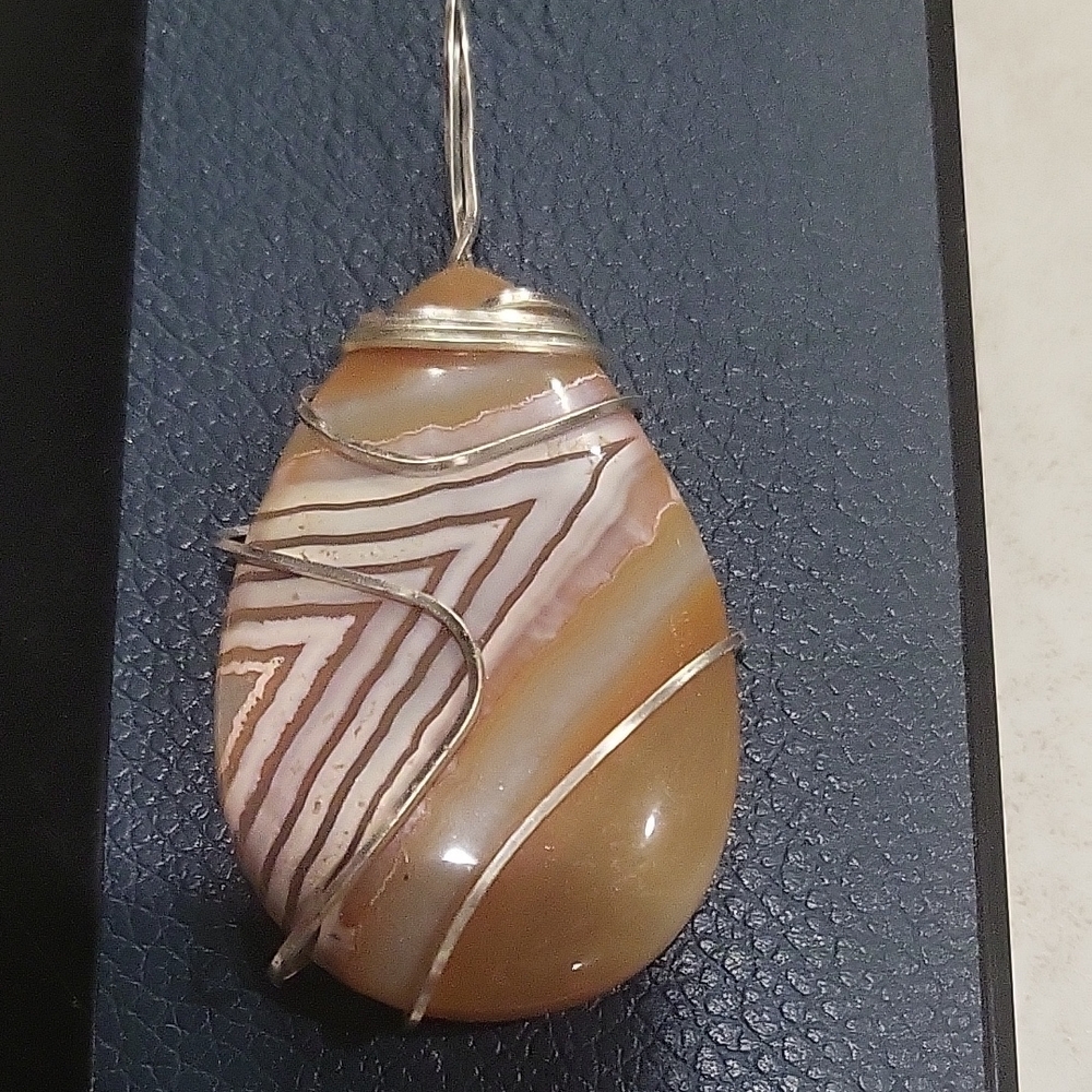 Elegant Silver and Brown Teardrop Pendant